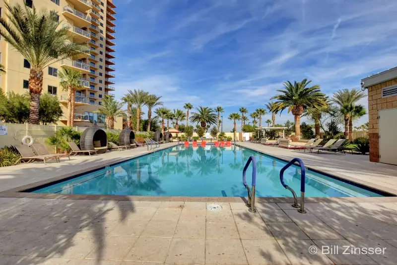 One Las Vegas Resort Pool with palm trees and lounge chairs